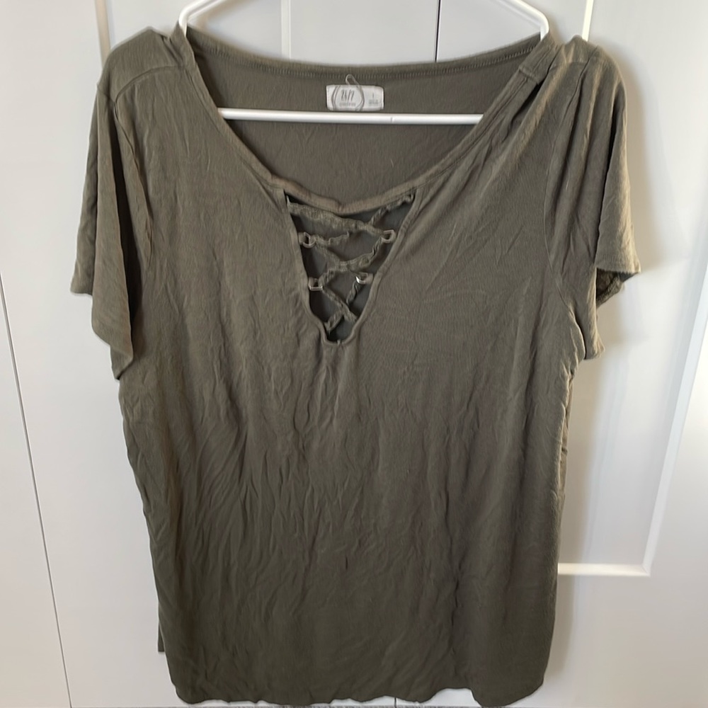 Maurice’s green t-shirt with b-neck and crisscross lace detail